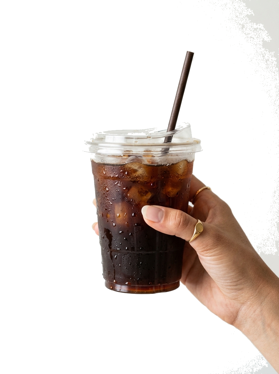Hand holding iced Chelvis Coffee takeaway cup